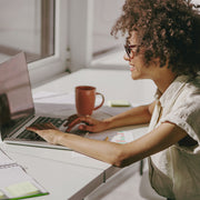 woman working on real estate marketing ideas printables from simple desert designs